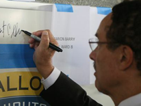 DC Mayor Vincent C. Gray signing school emblem - Ballou High School 'Topping Out' Ceremony DC Mayor Vincent C. Gray signing school emblem - Ballou High School 'Topping Out' Ceremony