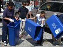 The Ross Recycling Team dumps water from their recycling bins after completely their “Recycling Bin Dance.” The Ross Recycling Team dumps water from their recycling bins after completely their “Recycling Bin Dance.”