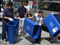 The Ross Recycling Team dumps water from their recycling bins after completely their “Recycling Bin Dance.”