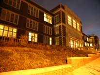 Cardozo High School - facade illuminated at night