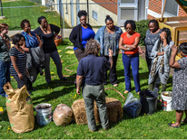 Teachers and staff from Randle Highlands learn about managing their on-site garden compost bin provided by DGS and Benny Erez of ECO City Farms.