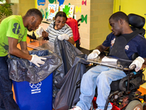 These Sharpe Health students hold a collection bag while another student empties recycling bins into the bag to consolidate the recyclables from around the entire school building. These Sharpe Health students hold a collection bag while another student empties recycling bins into the bag to consolidate the recyclables from around the entire school building.