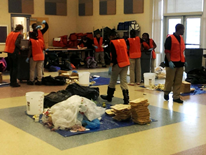 Teams of Walker-Jones sixth grade students sort through their school's kitchen and cafeteria waste to gather data on the waste streams created from their school lunches. Teams of Walker-Jones sixth grade students sort through their school's kitchen and cafeteria waste to gather data on the waste streams created from their school lunches.